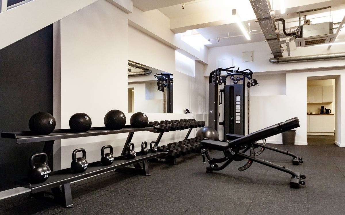 Eleiko kettlebells, medicine balls and an adjustable bench in the studio's conditioning area