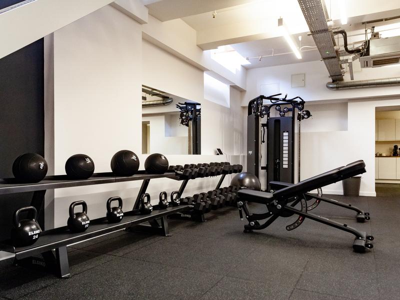 Eleiko kettlebells, medicine balls and an adjustable bench in the studio's conditioning area